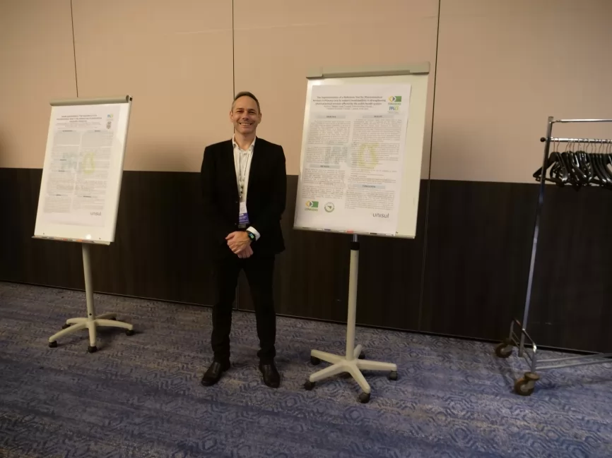A researcher presenting his work during the poster session